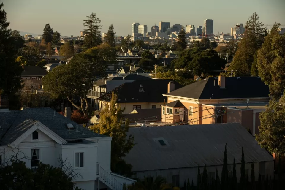 View of homes and Alameda, California skyline in background